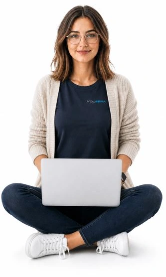 Young lady working on a laptop using Volsera Web Hosting services